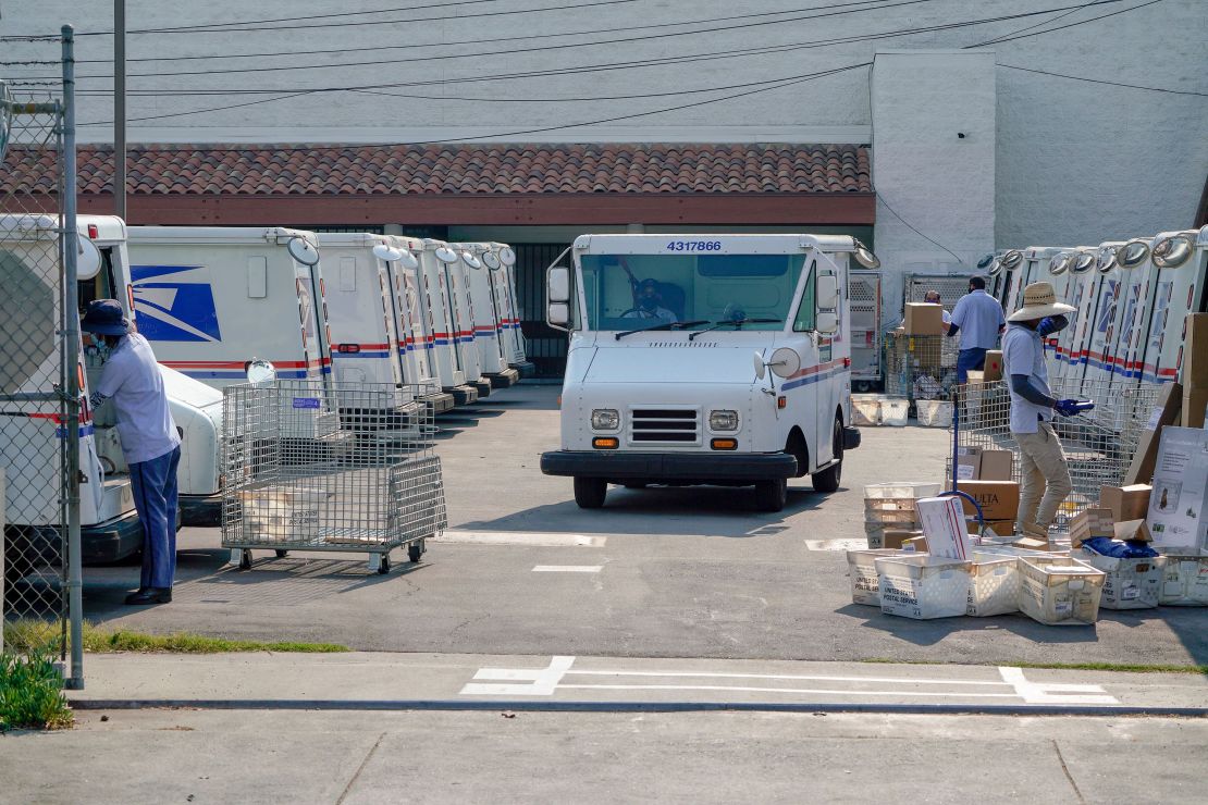 Postal workers sort, load and deliver mails in Los Angeles in 2020.